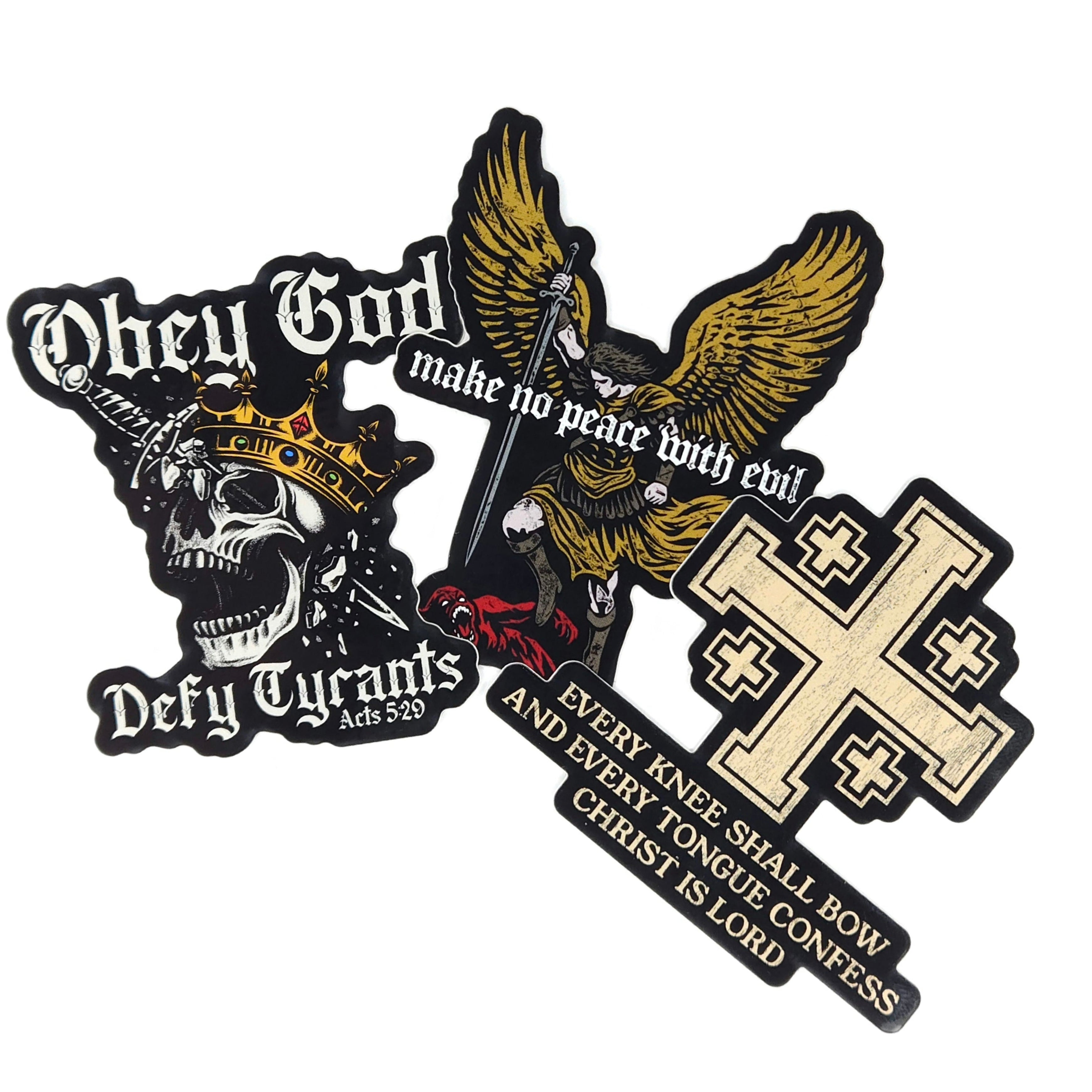 Three overlapping rectangular stickers with a black border featuring religious and political slogans: 'Obey God', 'Defy Tyrants', 'make no peace with evil', and 'EVERY KNEE SHALL BOW AND EVERY TONGUE CONFESS CHRIST IS LORD' with a cross design.